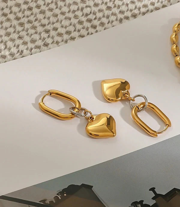 Golden Oval Hoop Earrings with Puffed Heart Charms