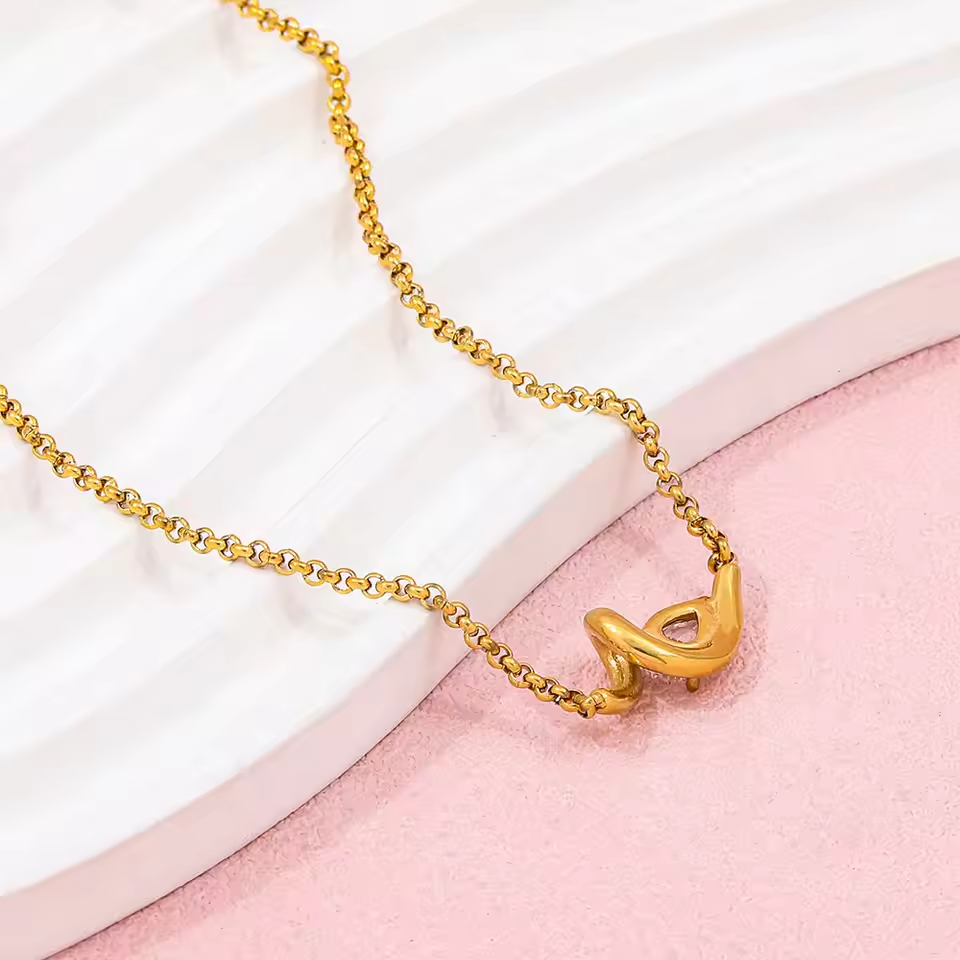 Golden Abstract Ribbon Necklace with Pear-Cut Stone