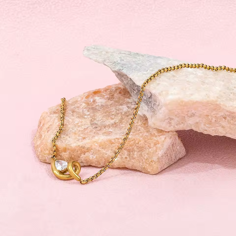 Golden Abstract Ribbon Necklace with Pear-Cut Stone